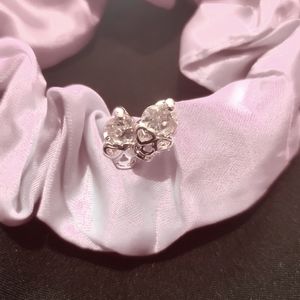 Rose gold colored skull earrings